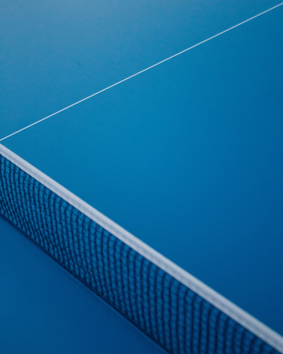 a close up of a tennis court with a net